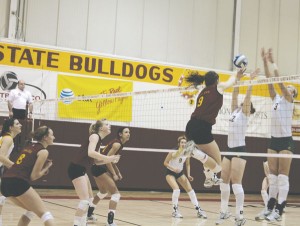 Flying High: Senior Sarah Lark spikes the ball over opponents during a recent game. The volleyball team will travel to Indianapolis on the 19th for the first round of NCAA D-II Midwest Region games. Photo By: Kate Dupon | Photgrapher Flying High: Senior Sarah Lark spikes the ball over opponents during a recent game. The volleyball team will travel to Indianapolis on the 19th for the first round of NCAA D-II Midwest Region games. Photo By: Kate Dupon | Photgrapher
