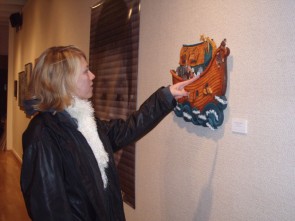 KCAD/FSU Exhibition: A student enjoys the faculty exhibit Tuesday morning. The showcase includes pieces from both Ferris and Kendall faculty. Photo by Brandy VanDenbrook, Copy Editor