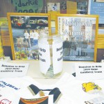 Rube Goldberg: Pictured here are trophies earned by the Ferris State Rube Goldberg team in 2007 along with a photo of the team that will now be heading to Japan to take part in a game show. Photo By: Kristyn Sonnenberg | Photo Editor
