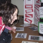 The Road to Freedom: A student takes in some historical facts and photos in last year’s Room of Reflection, which, along with the Tunnel of Oppression, is a part of Martin Luther King Jr. Week aimed at providing information on past and current oppression and how to help fight it. Torch file photo