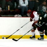 Guiding the Puck: Sophomore Jordie Johnston pulls away from a Norhern Michigan opponent at Wink Arena on Friday. The game ended with a 3-3 tie in overtime. Saturday’s loss brings the team to a 17-8-4 record for the season. Photo By: Kate Dupon | Photographer Guiding the Puck: Sophomore Jordie Johnston pulls away from a Norhern Michigan opponent at Wink Arena on Friday. The game ended with a 3-3 tie in overtime. Saturday’s loss brings the team to a 17-8-4 record for the season. Photo By: Kate Dupon | Photographer