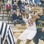 Block Out: Justin Keenan, a junior from Grand Rapids, blocks out a Northern Michigan opponent at a recent game. Keenan scored 35 points, a career high, in Saturday’s game alone and just earned the title of GLIAC Men’s Basketball North Division Player of the Week for the fourth consecutive week. Photo By: Kristyn Sonnenberg | Photo Editor