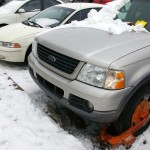 Getting the Boot: A vehicle sits trapped in the parking lot near the Music Building after recieving a number of tickets, a boot, and a notice reading: “WARNING: DO NOT MOVE THIS VEHICLE.” Students’ concerns about the parking situation on campus are heightened during these winter months when the lines defining parking spots are covered in snow. Photo By: Kristyn Sonnenberg | Photo Editor