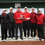 We Are the Champions: The Ferris State golf team stands with the championship trophy they earned at the annual Fossum/Spartan Invitational this Sunday. They tied with the Michigan State University team with a score of 879. The one-hole playoff between the two teams ended in a 16-all tie. Photo Courtesy of Matthew Mitchell, MSU Athletic Communications