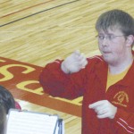 Jason Workman: Jason Workman, Ferris State senior in biotechnology and student conductor of the FSU Athletic Pep Band, leads the group during a basketball game. Workman has done the same for 3,500 songs at 140 events. Photo Courtesy of Dale Skornia, Jason Workman: Jason Workman, Ferris State senior in biotechnology and student conductor of the FSU Athletic Pep Band, leads the group during a basketball game. Workman has done the same for 3,500 songs at 140 events. Photo Courtesy of Dale Skornia,