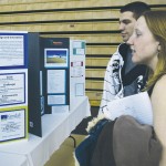 Conserve and Convert: FSU students Leah Tandy and Dustin Broewer study the student-made informative posters entered into the poster competition at the Michigan Energy Conference at Wink Arena last week. Photo By: Kristyn Sonnenberg | Photo Editor Conserve and Convert: FSU students Leah Tandy and Dustin Broewer study the student-made informative posters entered into the poster competition at the Michigan Energy Conference at Wink Arena last week. Photo By: Kristyn Sonnenberg | Photo Editor