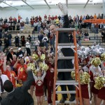 Cutting Down the Nets: Bulldog head coach Bill Sall holds the net after the team’s victory over Findlay on Feb. 19. in which the men’s basketball team claimed the GLIAC North title. Photo By: Brock Copus | Photographer