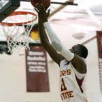 Reaching High: Senior Lou Williams reaches for a basket during the game against Grand Valley on Feb. 26. Williams holds the school record for blocked shots in a career. Photo By: Brock Copus | Photographer