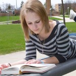 Leisure Reading: Marissa Basty reads Harry Potter during a study break. Students can use the summer to catch up on all their favorite reading. Photo By: Brock Copus | Web Editor