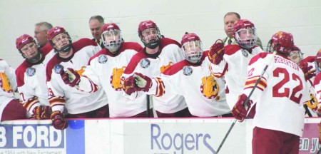 High Fives All Around: Bulldog freshman forward Matt Robertson celebrates with his teammates Friday night after scoring his first collegiate goal against the University of Michigan. Ferris State defeated the Wolverines 5-0 on Friday and suffered a shootout loss Saturday night after a 3-3 overtime tie. Photo By: Brock Copus | Multimedia Editor