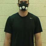 Masking It: Elevation masks were donated to the Ferris football team to help improve lung stamina. Shown above on sophomore quarterback Taylor Masiewicz, the mask covers the nose and mouth to reduce the level of oxygen intake. Photo By: Tori Thomas | Photographer