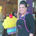 Delicious Treats: Founder Nawal Braden-Swart poses at the storefront of Nawal’s Mediterranean Eatery. The locale offers daily lunch and dinner options as well as cupcakes and other treats. Photo By: Tori Thomas| Photographer